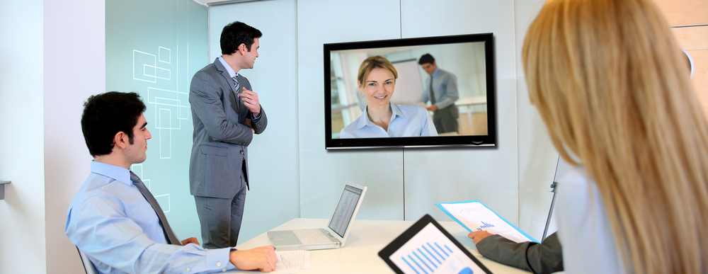 Business people attending videoconference meeting rect